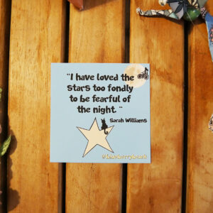 sticker with the text i have loved the stars too fondly to be fearful of the night and a cat sitting on a star