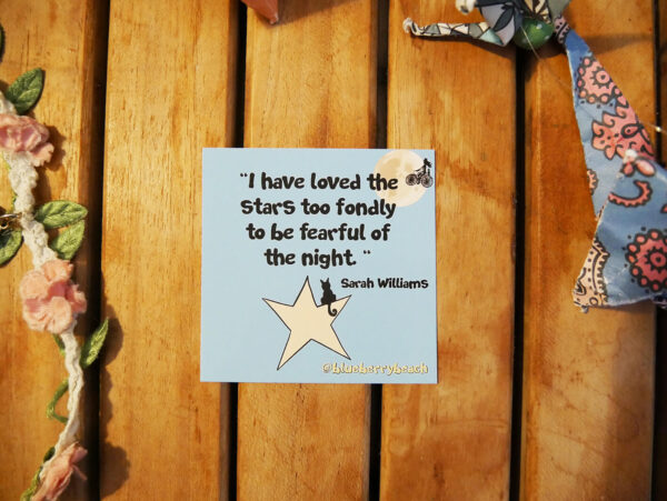 sticker with the text i have loved the stars too fondly to be fearful of the night and a cat sitting on a star