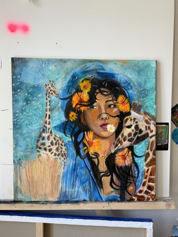 Portrait giraffe woman with flowers in the hair